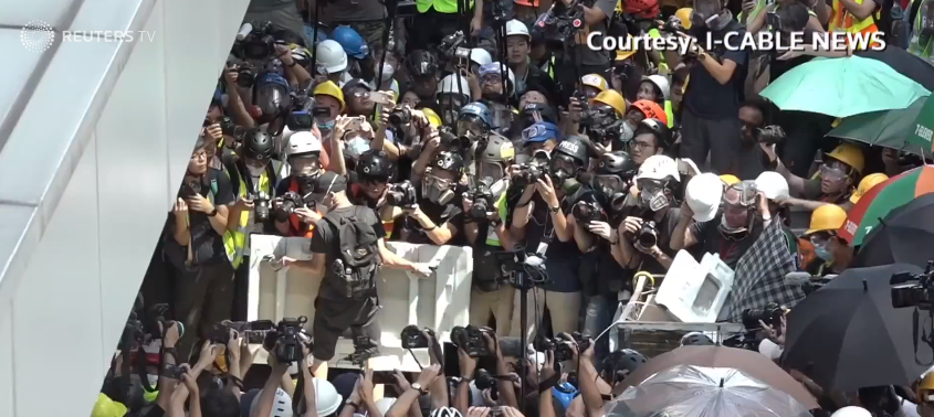 Hong Kong Police Fire Tear Gas in Running Battles After Protesters Trash Legislature